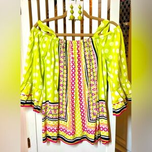 Lime off the shoulder top with coordinating earrings.